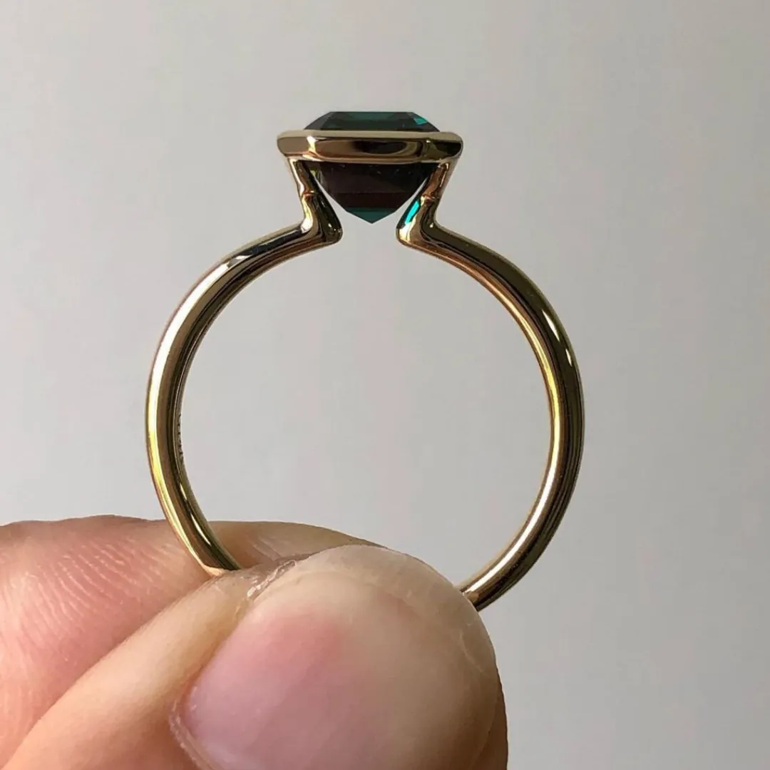 /public/photos/live/Half Bezel Set Moissanite Green Emerald Ring 510 (1).webp